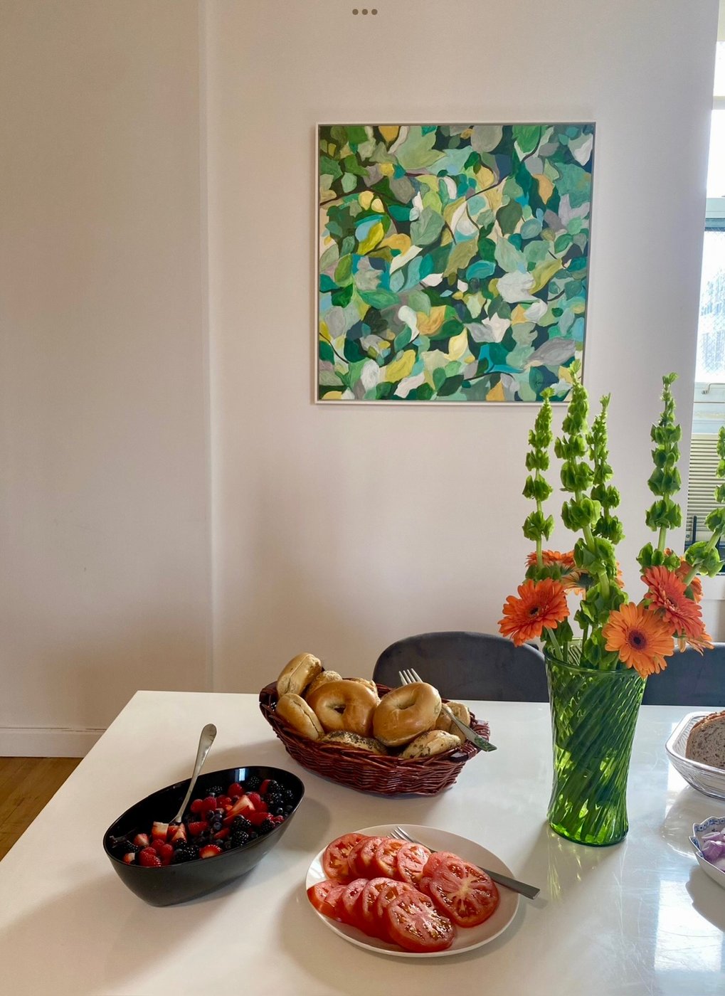 Botanical painting above a dining table