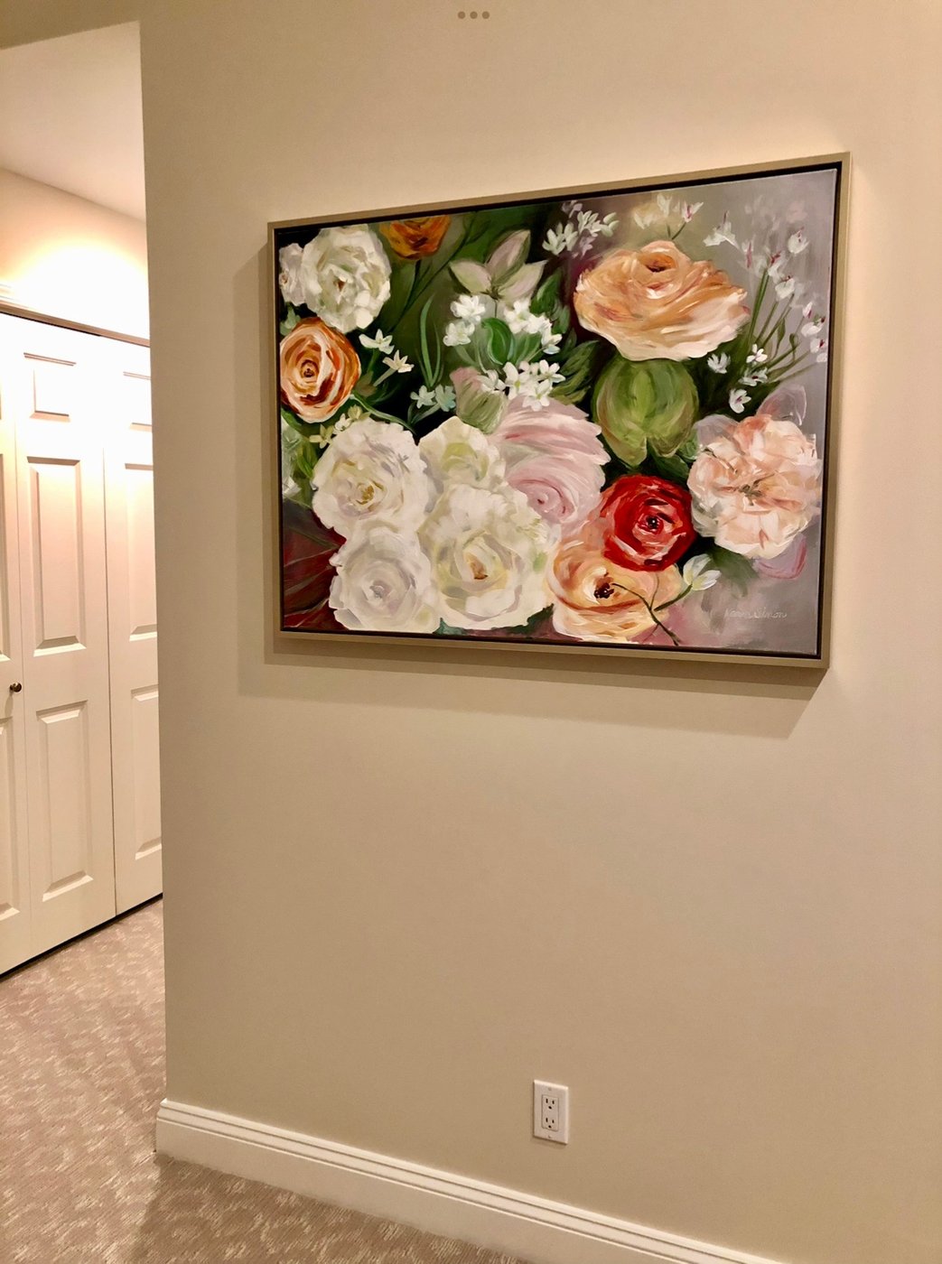 Bouquet painting displayed in a home hallway
